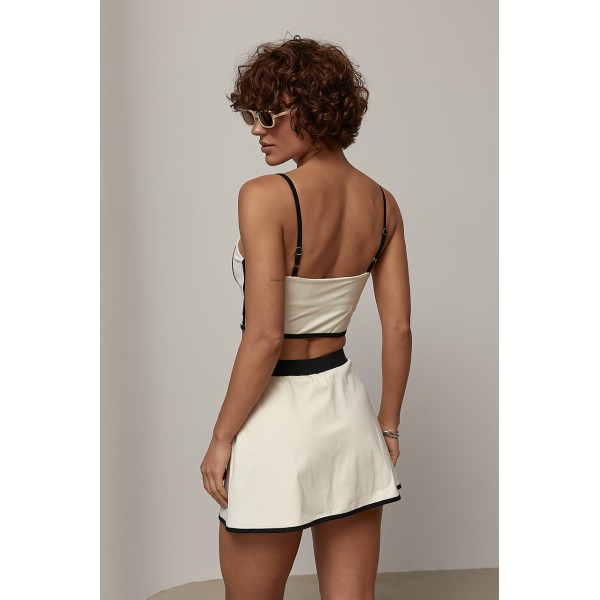 Спортивный костюм женский с топом и юбкой-шортами Lurex