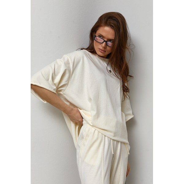 Костюм жіночий трикотажний вільного крою кремовий Lurex