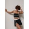 Спортивный костюм женский с топом и юбкой-шортами Lurex