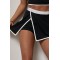 Спортивный костюм женский с топом и юбкой-шортами Lurex